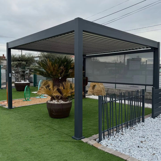 Build Excess grey aluminium electric pergola shown with optional privacy screen; landscaping and fencing excluded