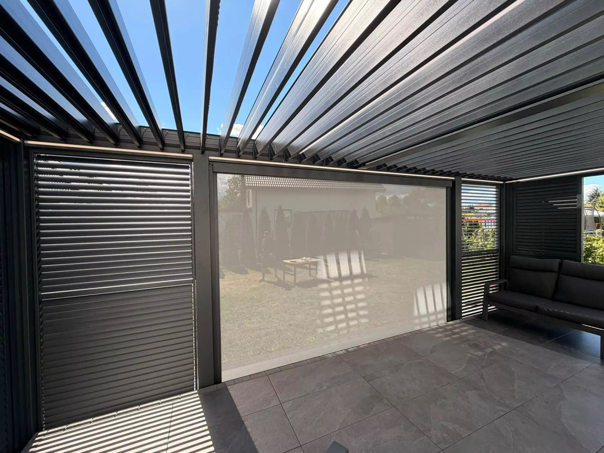 Open louvres and lighting detail in an illustrative pergola configuration with optional screen; side slat panels and furniture not included